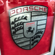 Illustration for article titled This Couple Topped Your Wildest Dreams By Getting Married In A Porsche Showroom